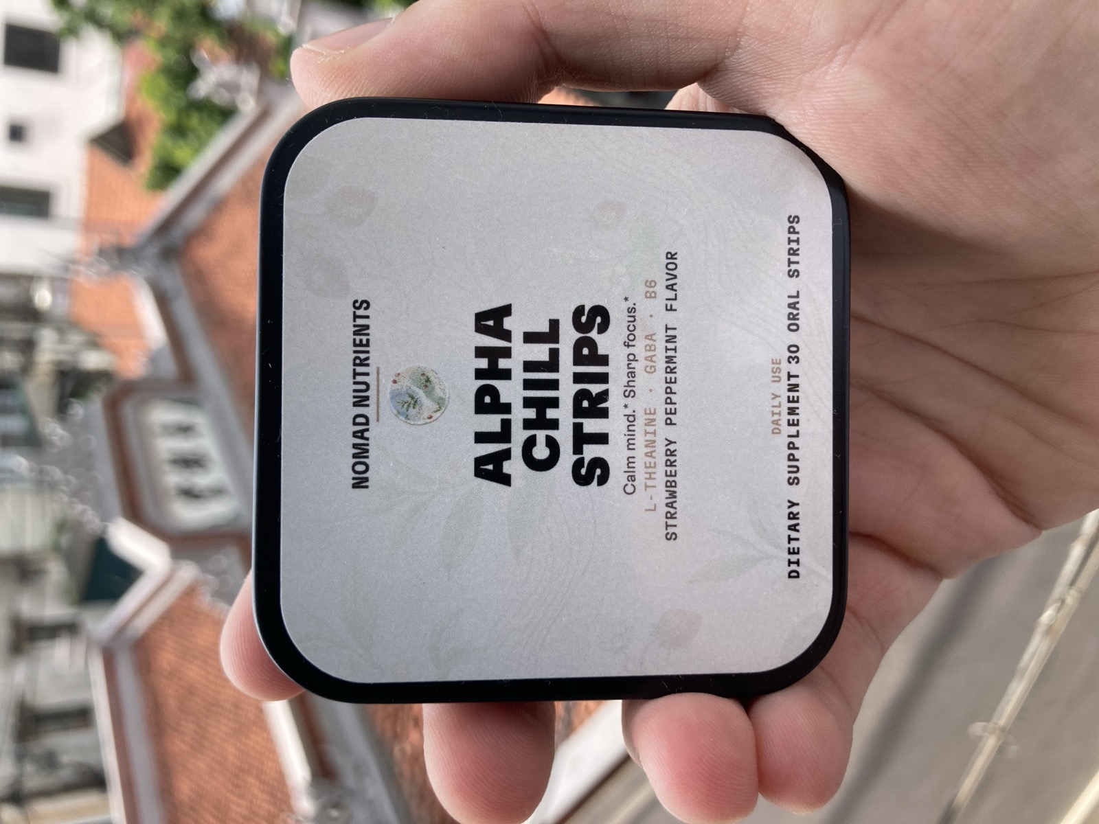 Alpha Chill Strips, held up on a Hanoi rooftop